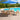 8 Piece Set, Okemo Table with 6 Chairs, 10-Foot Auto Tilt Umbrella Brilliant Blue